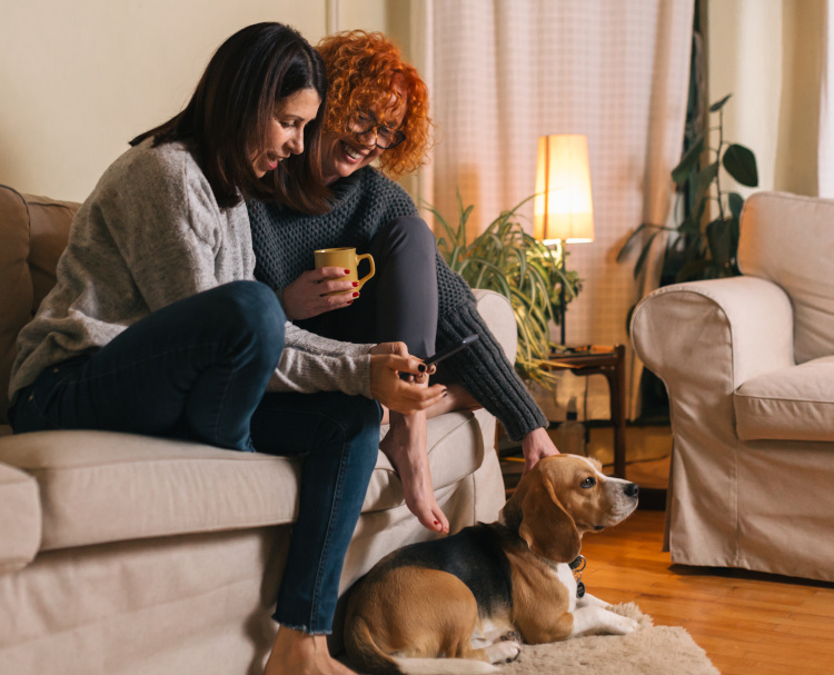 Two woman friends having great afternoon together at home