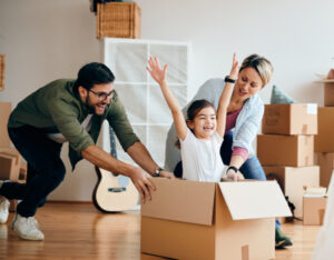 Carefree family having fun while moving into new home.
